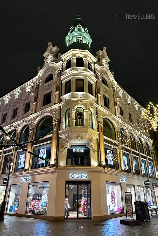An illuminated department store in Karl Johans Gate in Oslo