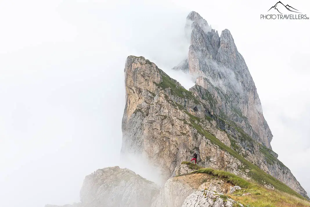 A lonely hiker in the Dolomites in the fog