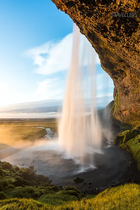 Seljalandsfoss in the evening with a view over the landscape