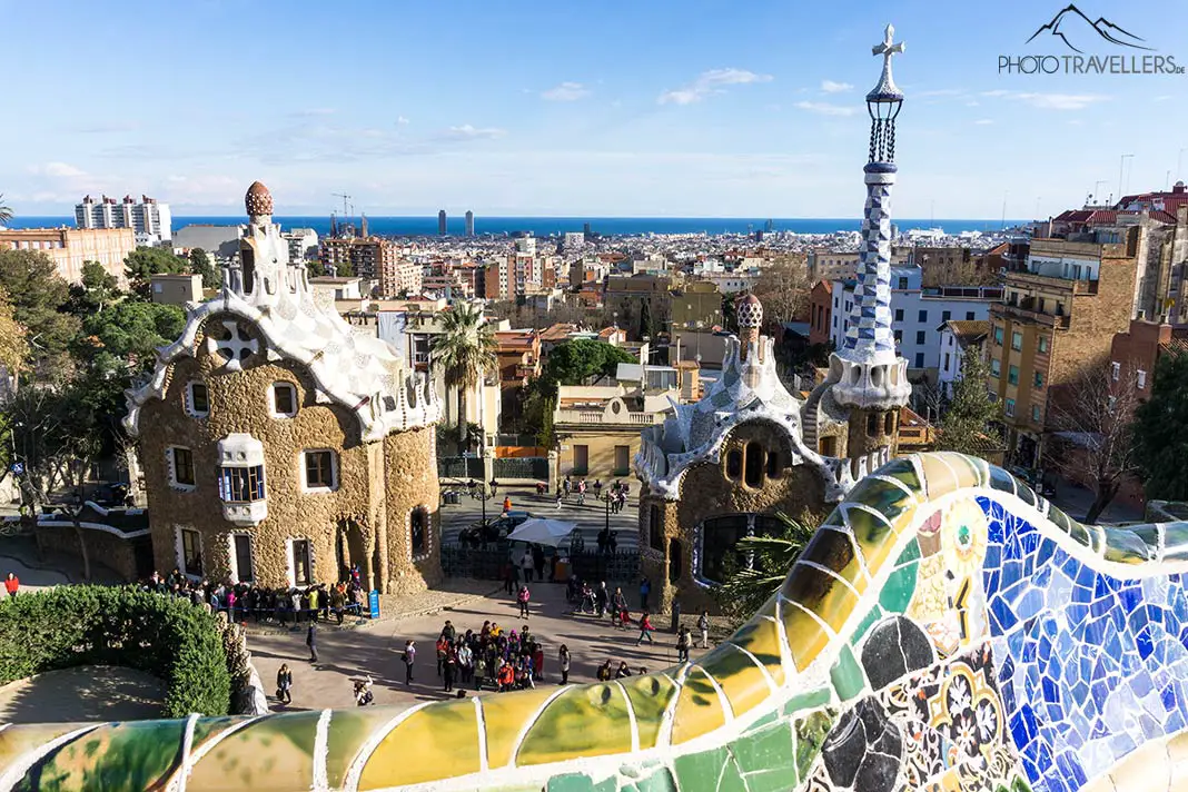 The view over Park Güell with mosaics in the foreground