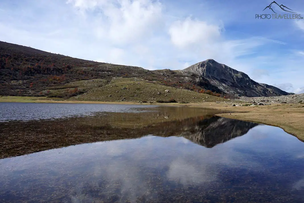 The reflection of the mountain Capu a u Tozzu in Corsica in a small lake