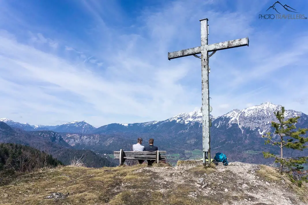 The summit cross on the Dötzenkopf with a view of the Berchtesgaden Alps
