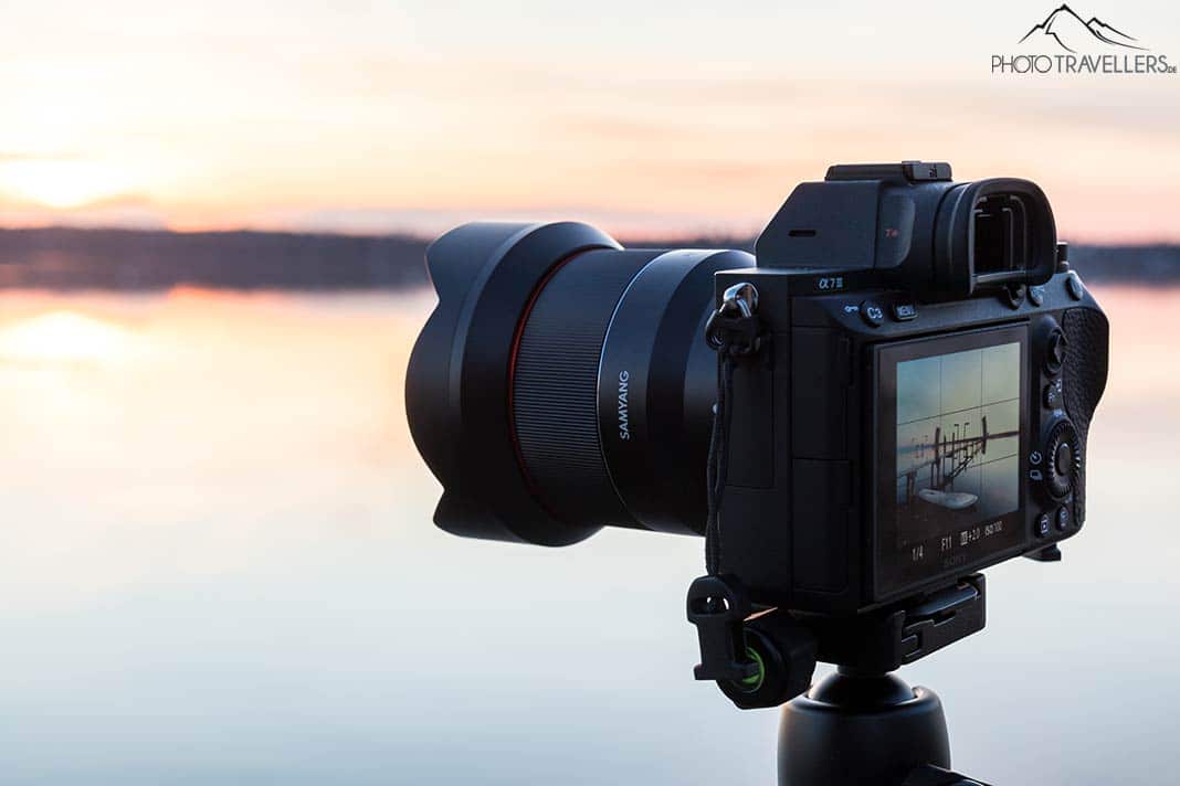 The Sony Alpha 7 III with the Samyang AF 14mm F2.8 Sony FE in front of a lake