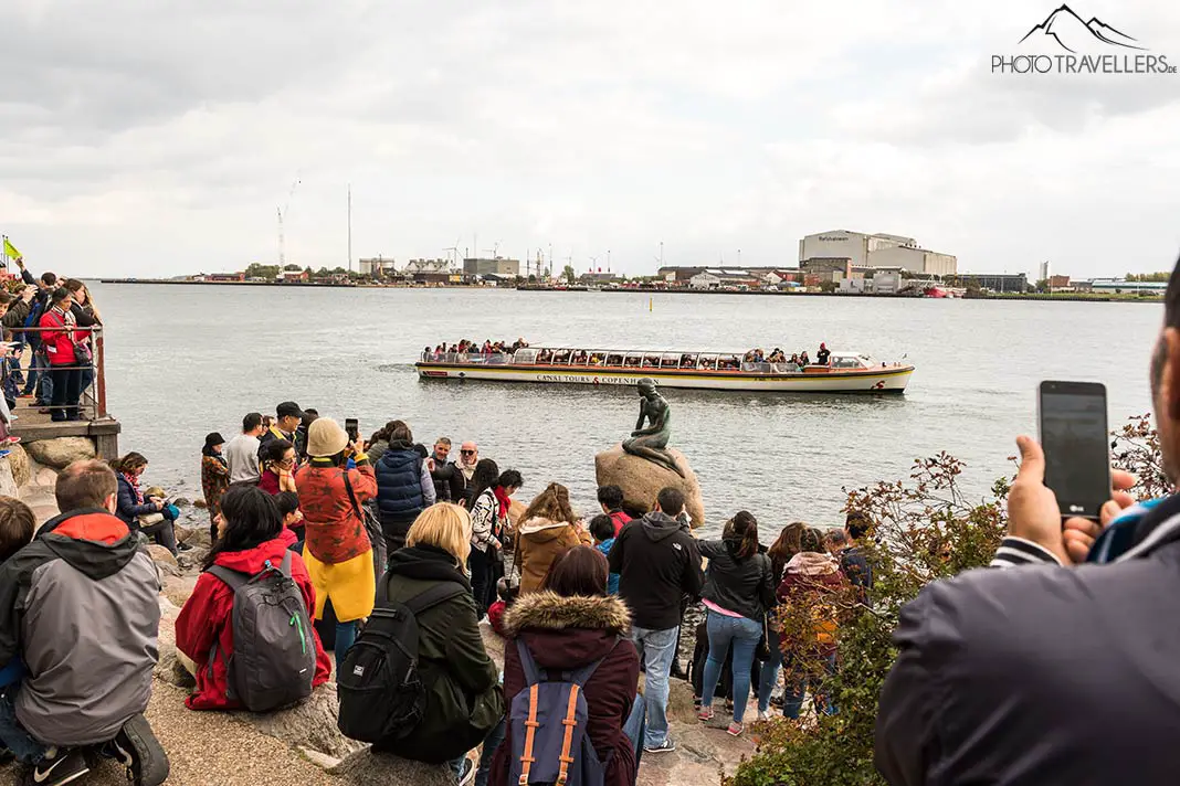 A crowd in front of the world's smallest landmark in Copenhagen