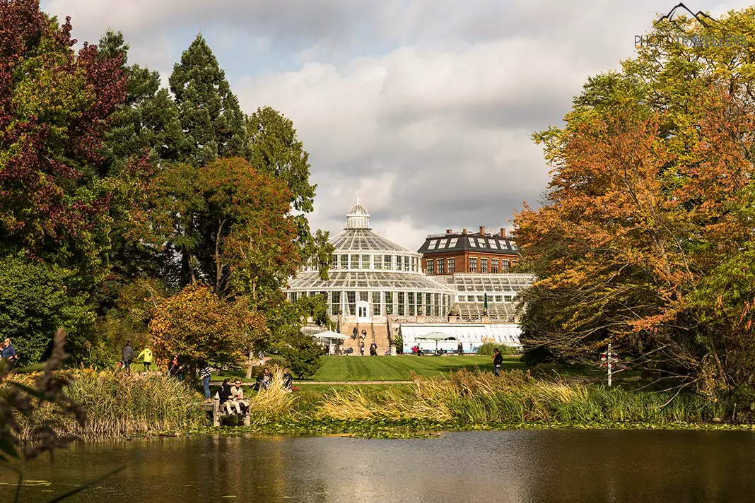 View of the Palm House in the Copenhagen Botanical Garden - in front of it there is water