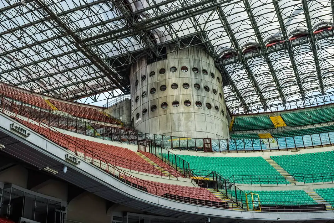 The Giuseppe-Meazza-Stadium with its impressive green and red seats