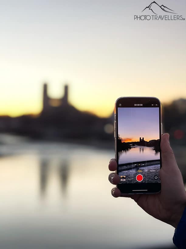 The iPhone 12 Pro Max records a video at dusk