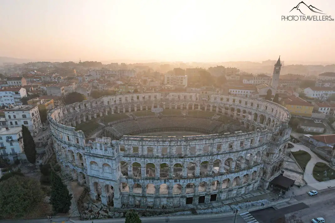 The amphitheater in Pula in the morning light from above
