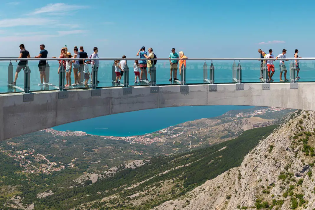 Visitors on the skywalk in Biokovo Nature Park with a sea view