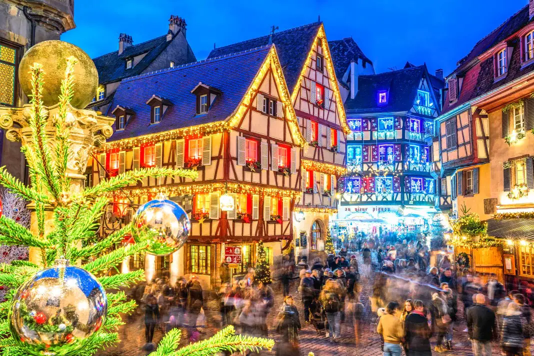 View of the illuminated facades of the Christmas market Colmar